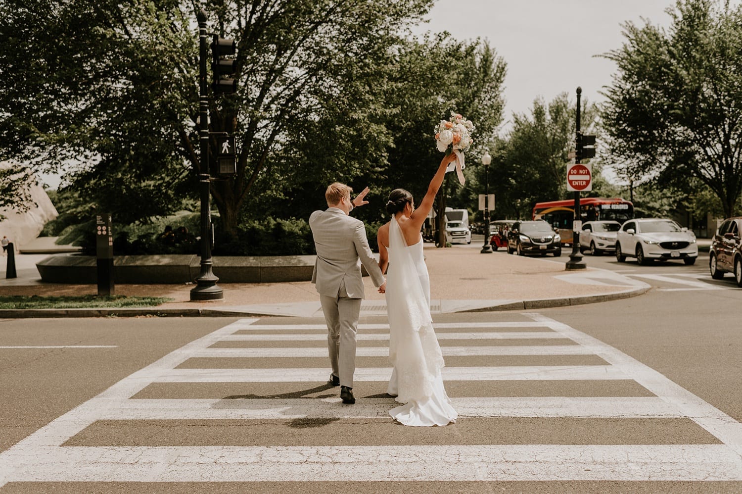 bride and groom crossing street in dc.jpg