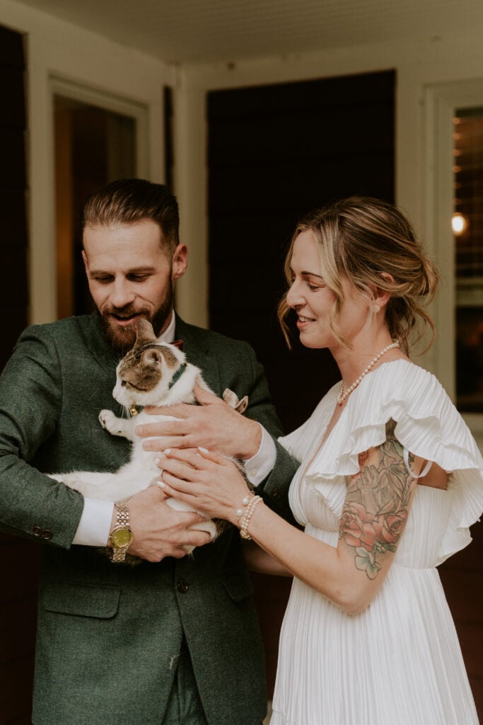 bride and groom with their cat