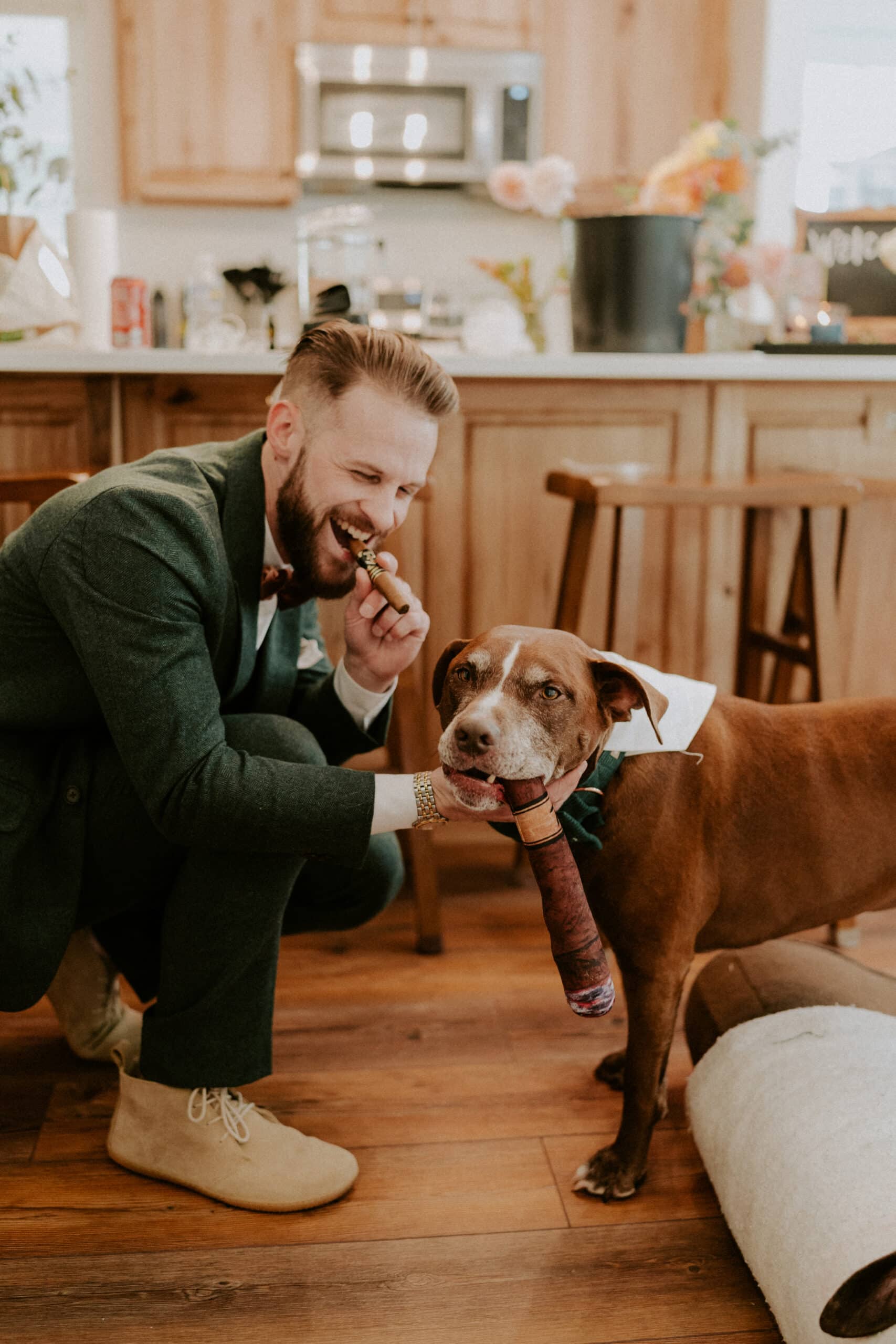 groom with a cigar and dog with a cigar toy