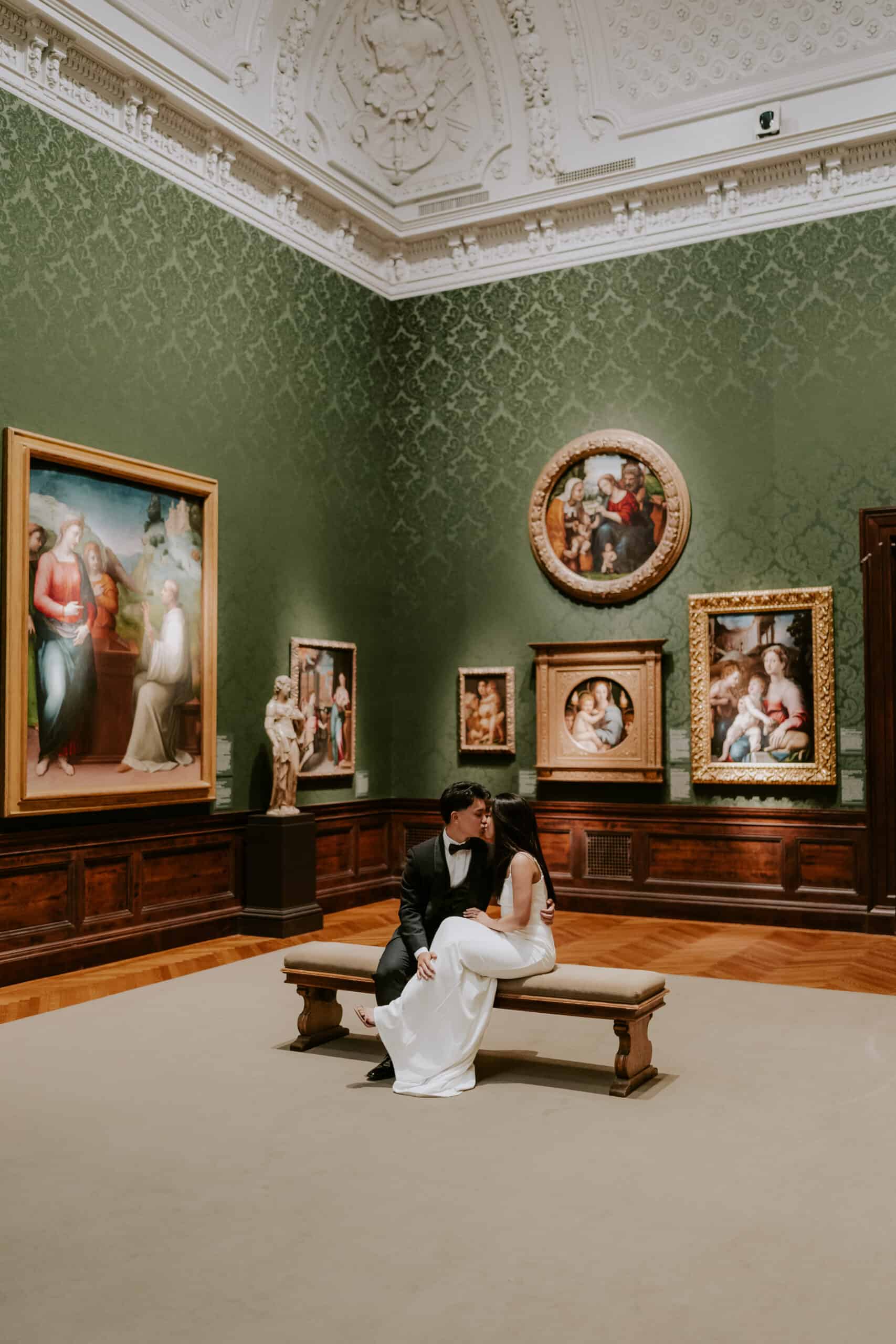 Couple sitting by art in Walters Art Museum Mt Vernon Baltimore