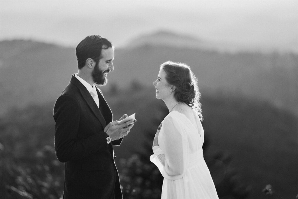 Bride and groom exchanging vows in Asheville North Carolina with mountains in background