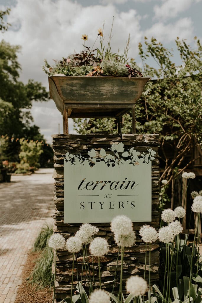 terrain at styers sign with spring flowers