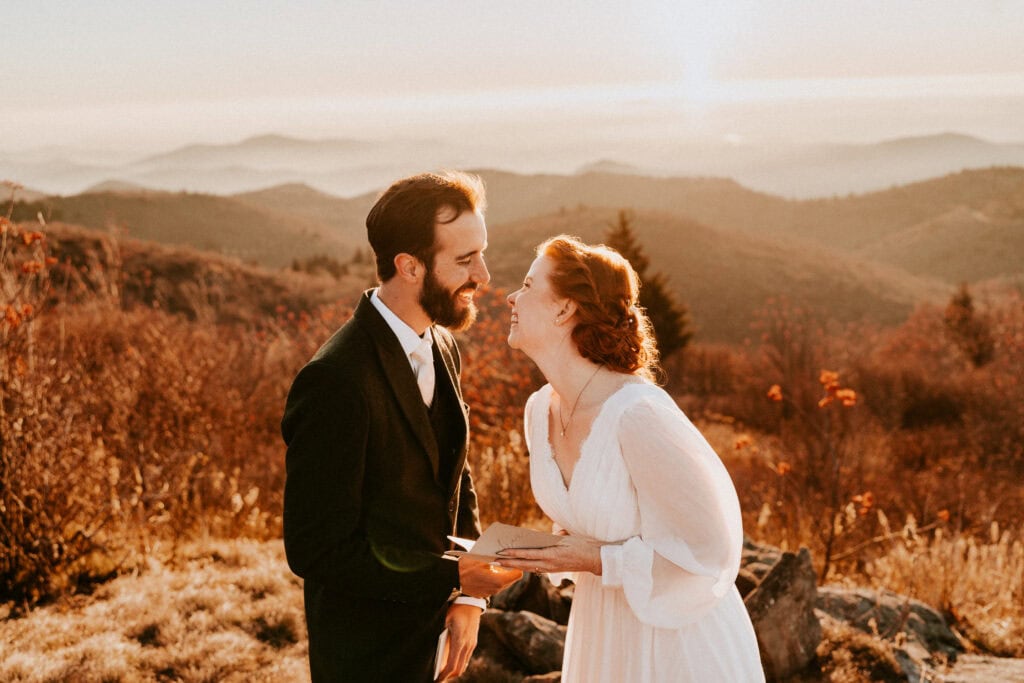 bride and groom exchanging vows on top of mountain just outside of asheville, nc 