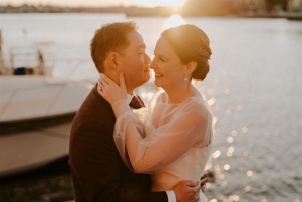 bride and groom walking around Fells Point for golden hour