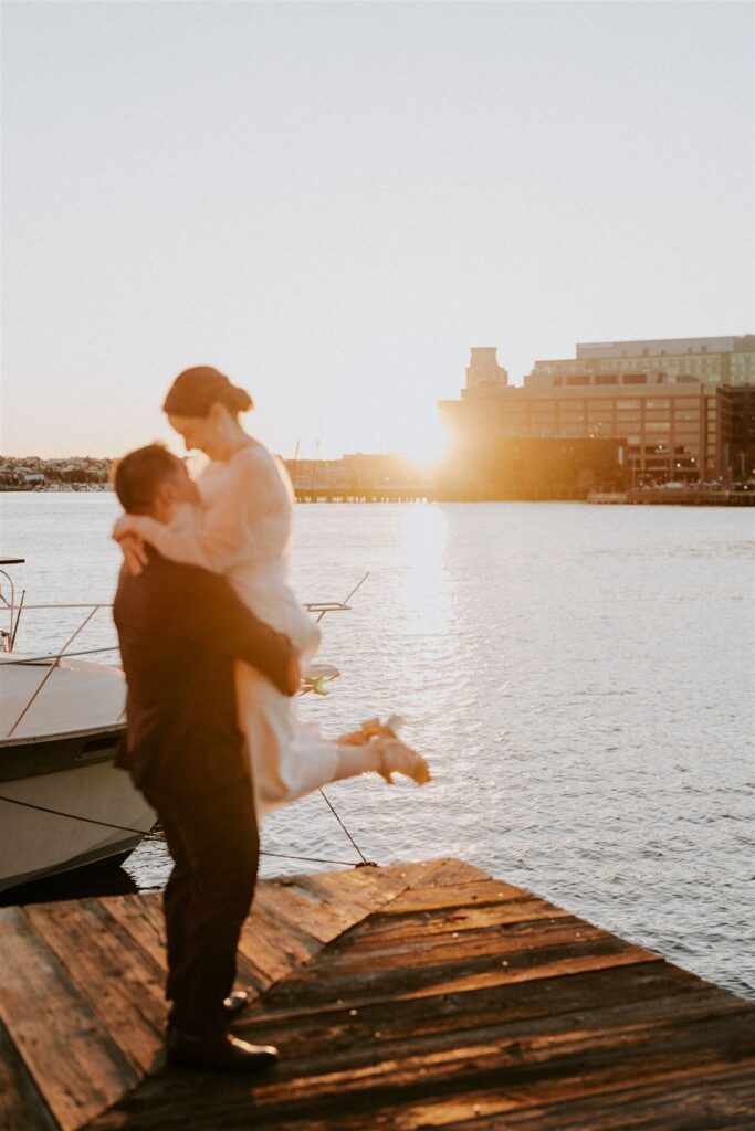 bride and groom walking around Fells Point for golden hour
