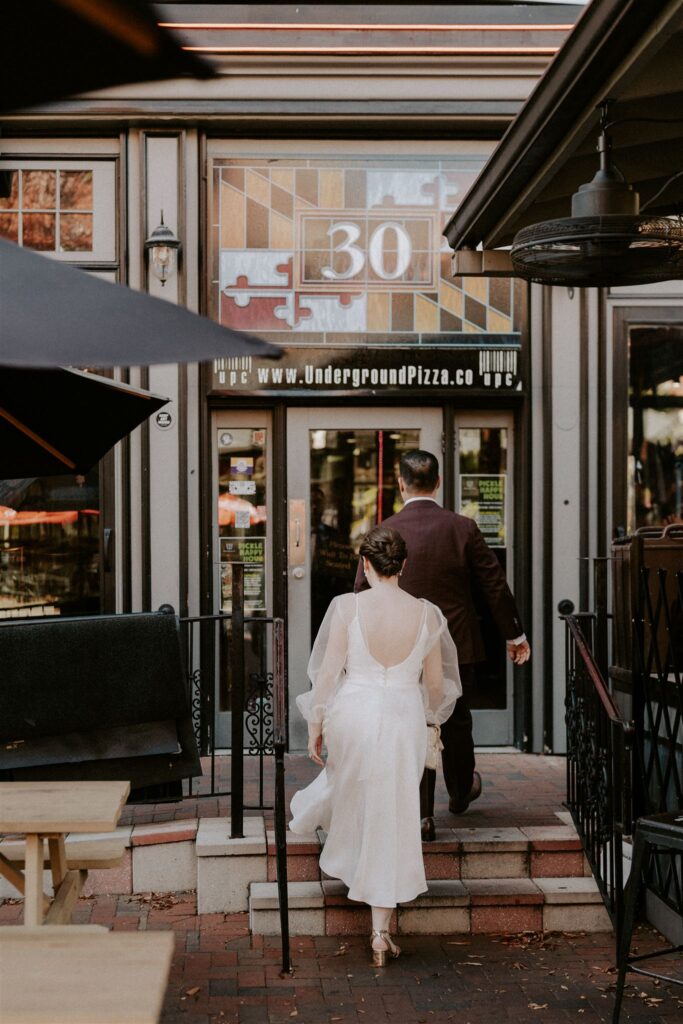 wedding couple walking to go and get pizza