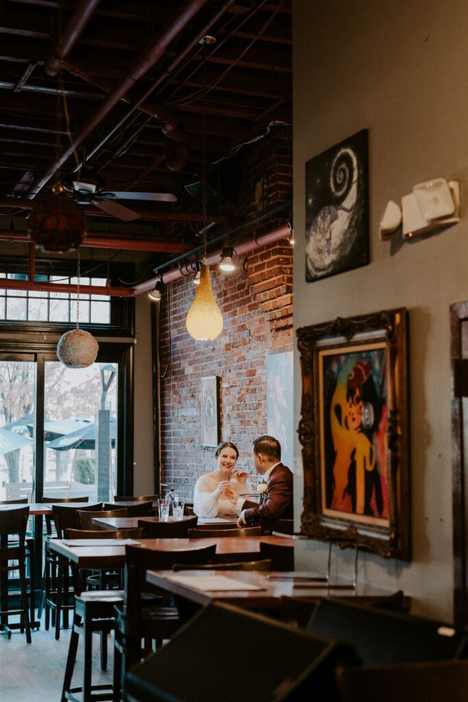 bride and groom enjoying pizza together during their baltimore elopement