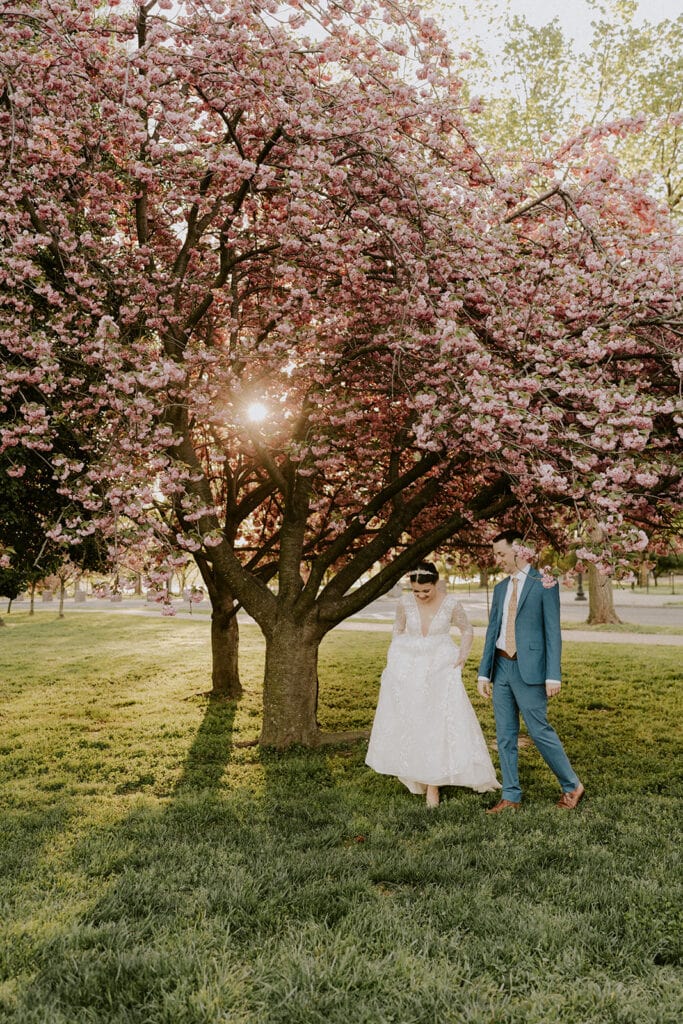 playful bride and groom during their dc cherry blossom wedding