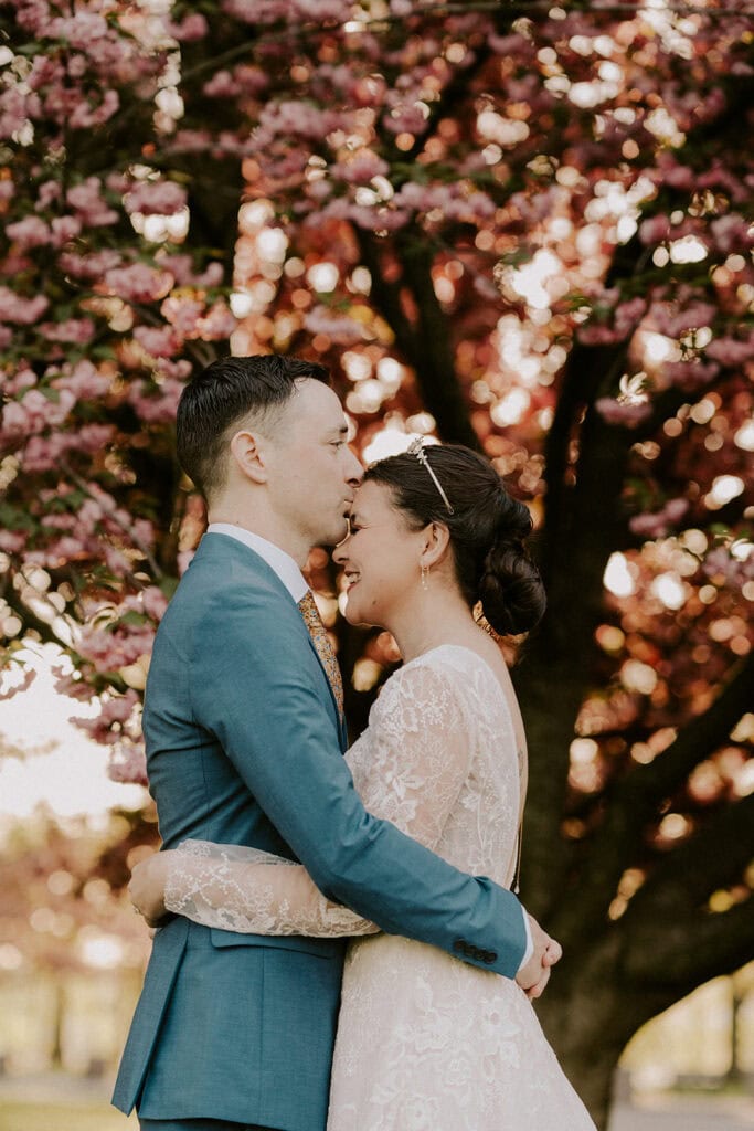 playful bride and groom during their dc cherry blossom wedding