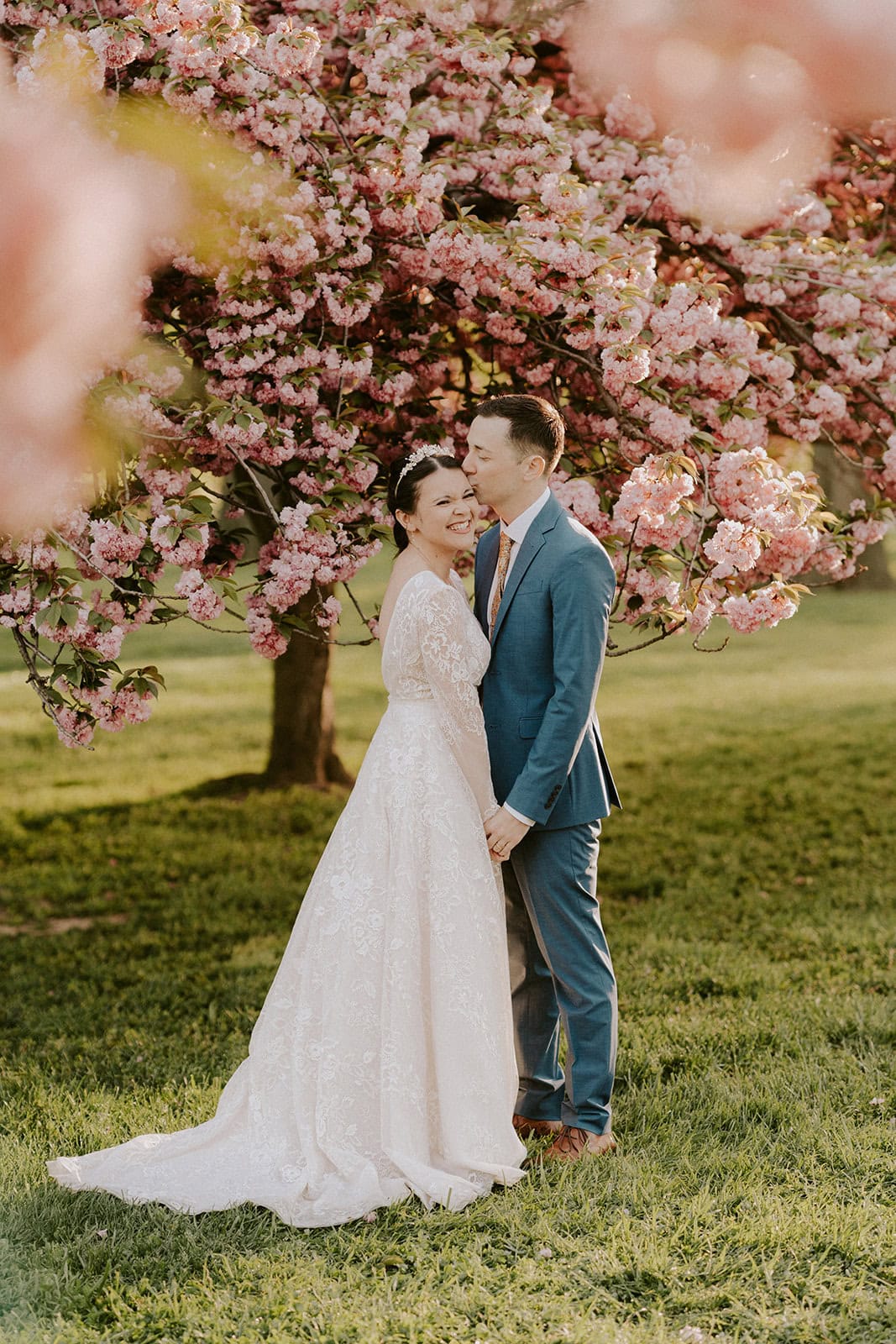 playful bride and groom during their dc cherry blossom wedding