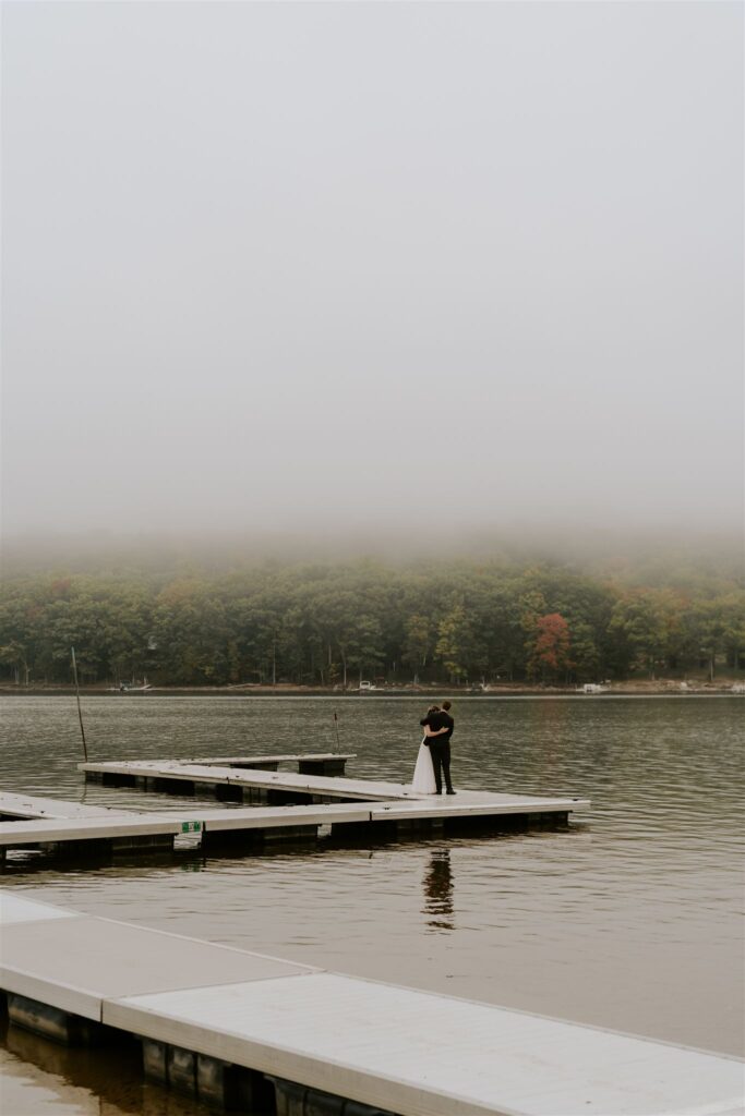 bride and groom first look on the docks at the deep creek lake