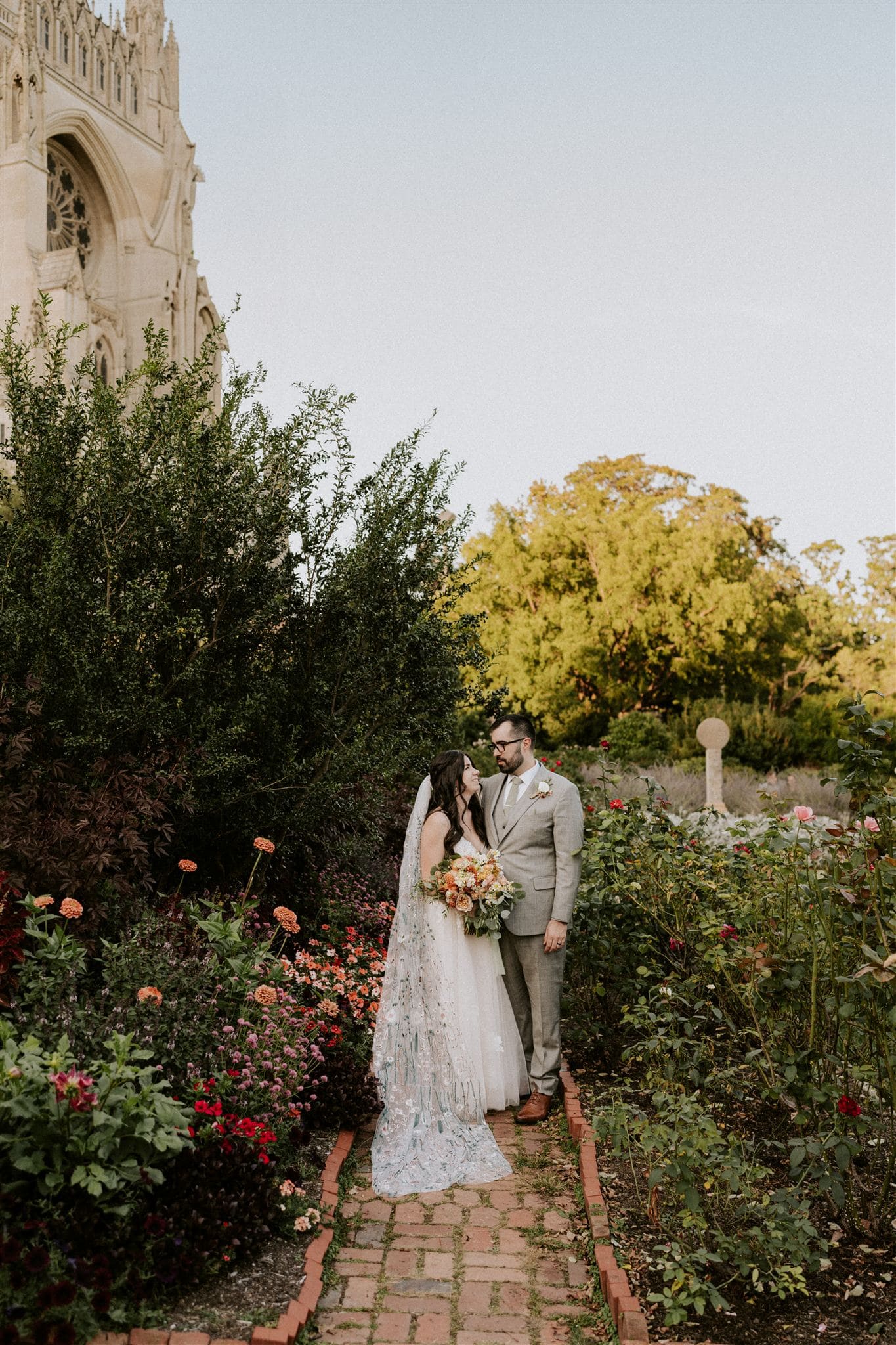 bride and groom during their garden elopement at the national cathedral gardens
