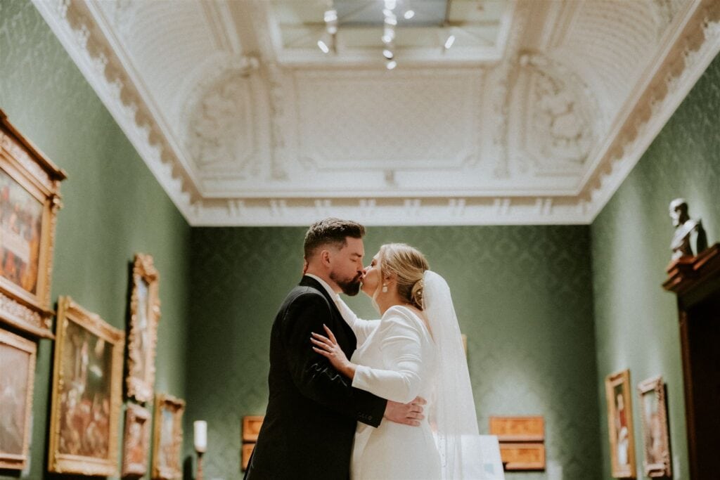 bride and groom kissing at the walters art museum