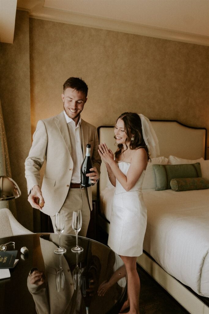 bride and groom celebrating their self officiated wedding in washington dc with a champagne toast