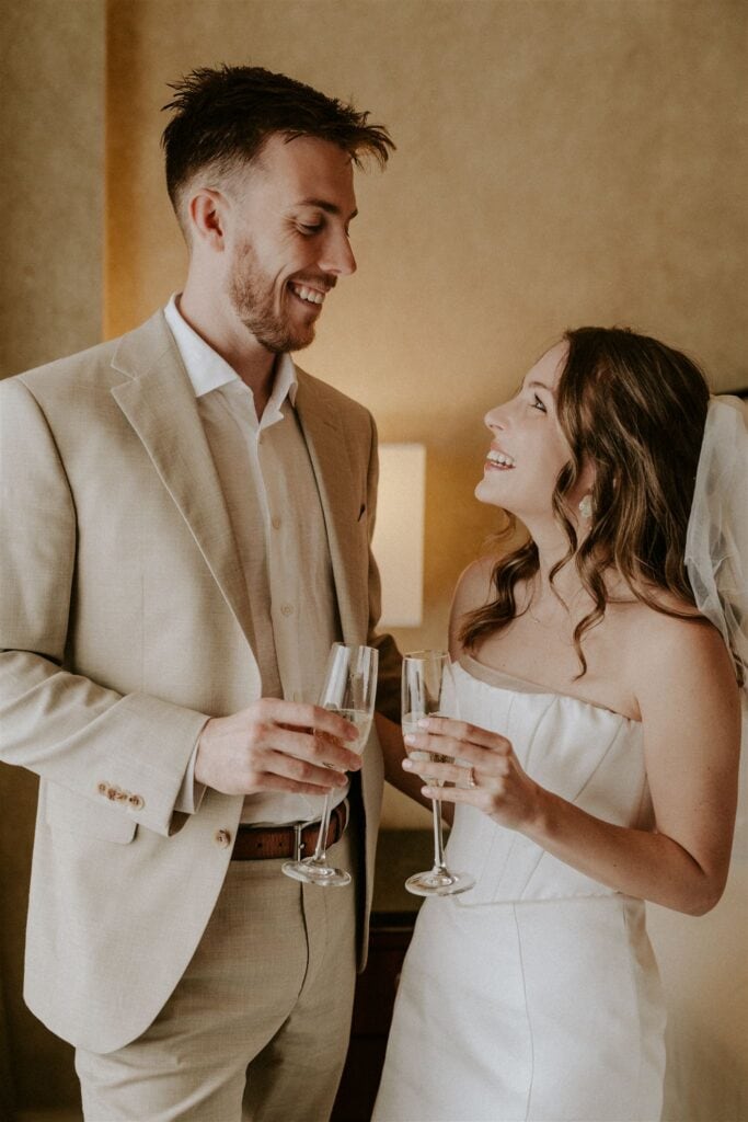 bride and groom celebrating their self officiated wedding in washington dc with a champagne toast
