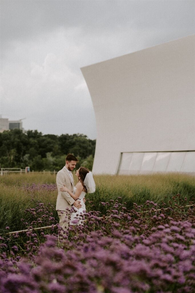 bride and groom in front of the kennedy center in washington dc