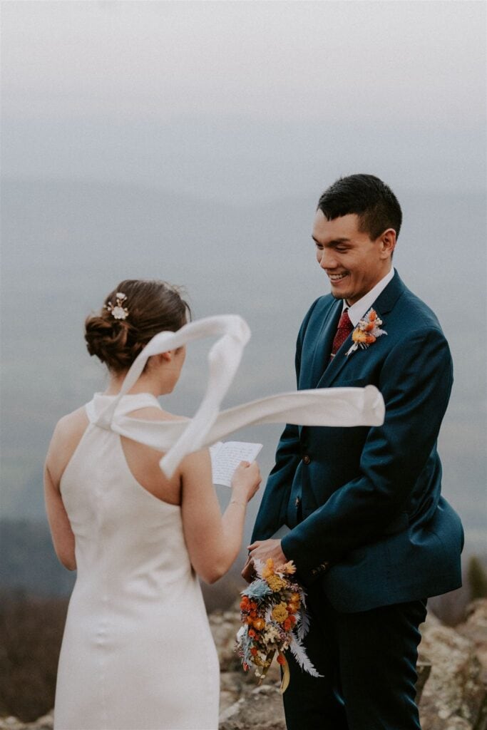 windy elopement ceremony moments at stony man trail during their shenandoah national park elopement