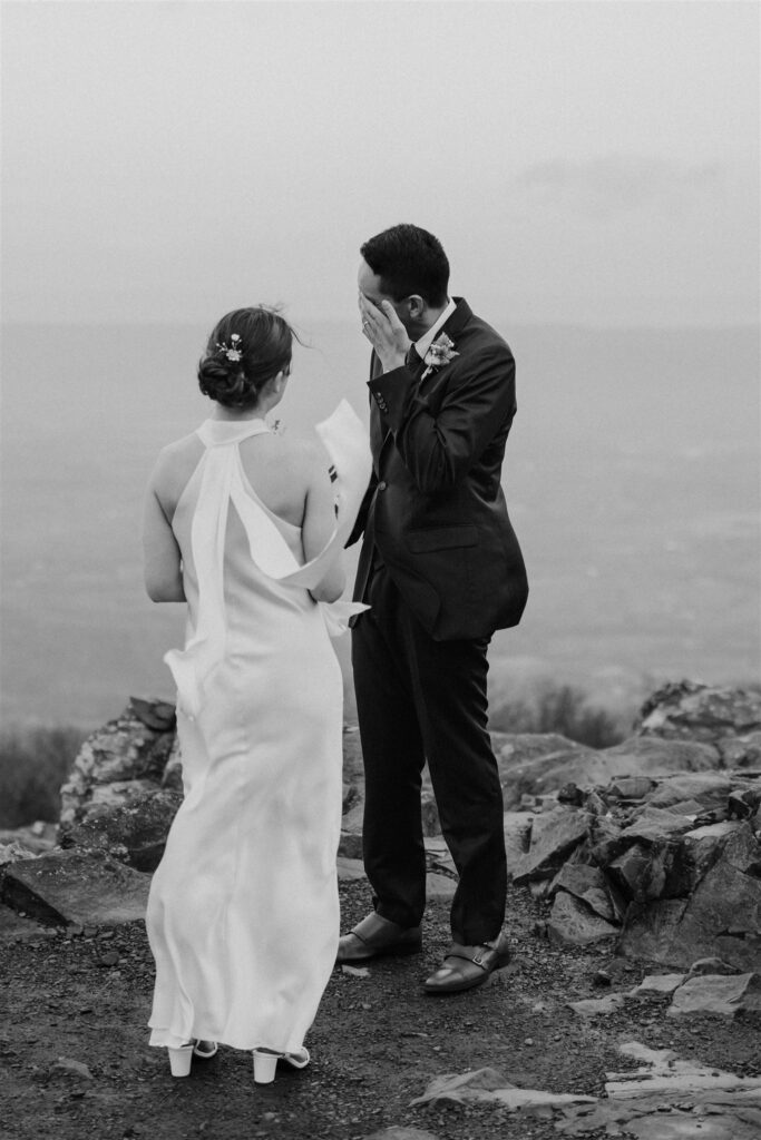 windy elopement ceremony moments at stony man trail during their shenandoah national park elopement